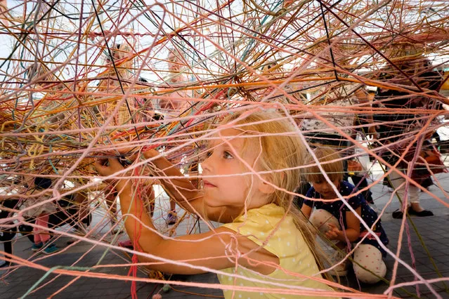 A girl plays at Stockholm's Culture Festival in Stockholm, capital of Sweden, on August 15, 2017. (Photo by Xinhua/Barcroft Images)