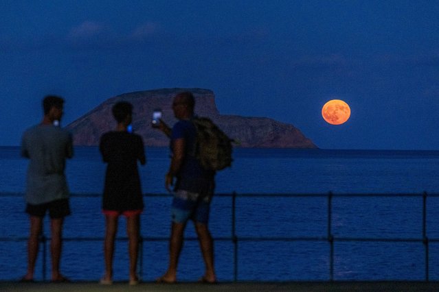 The full Moon which also called Super Blue Moon rises in lheus das Cabras, Angra do Heroismo, Terceira, Azores, Portugal, 19 August 2024. The world is witnessing this night the first full moon during 2024 which is called Super and Blue moon. (Photo by Antonio Araujo/LUSA)