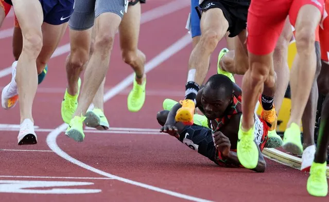 Kmari Taki of Kenya takes a tumble on the track in the Men’s 1,500 metres semi-final at Hayward Field, Oregon on July 17, 2022. (Photo by Lucy Nicholson/Reuters)