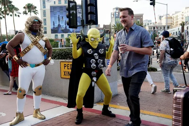 Performers cosplay as characters from the Netflix animated series Farzar to promote the show, outside Comic-Con International in San Diego, California, U.S., July 22, 2022. (Photo by Bing Guan/Reuters)