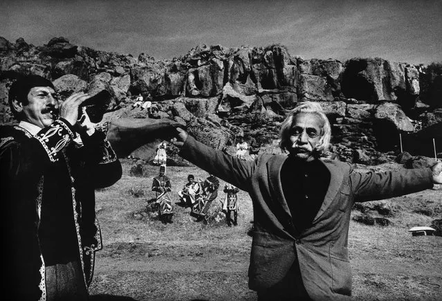 An Armenian man dances for his lost son in the mountains near Aparan, Armenia, 1998. “In 1998, I found myself in Aparan, a large town an hour’s drive from Armenia’s capital, Yerevan. A local dance troupe was performing that evening, in the open air, with most of the suburb in attendance. As soon as I took my first shot, an old man approached me. Tears streamed down his face. He told me that his son had died. That he had been electrocuted, that he was his pride and joy, and that I looked just like him. He broke into sobs and moved towards me with outstretched arms.”. (Photo by Antoine Agoudjian)