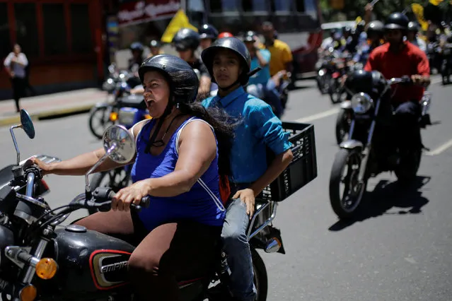 Opposition supporters ride on motorcycles as they take part in a rally to demand a referendum to remove Venezuela's President Nicolas Maduro in Caracas, Venezuela August 4, 2016. (Photo by Marco Bello/Reuters)