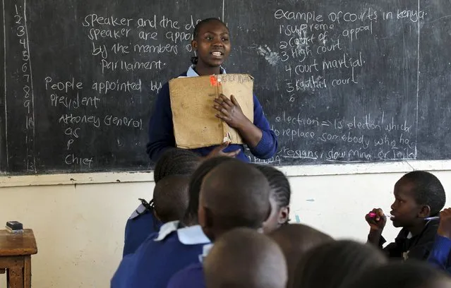 Sarah Nasira, 12, leads her classmates as they revise their class work without a teacher on the second week of a national teachers' strike, at Olympic Primary School in Kenya's capital Nairobi, September 9, 2015. The Kenya National Union of Teachers (KNUT) wants the Teachers Service Commission (TSC) to honour the 50-60 percent salary increment ordered by the Supreme Court in August, local media reported. (Photo by Thomas Mukoya/Reuters)