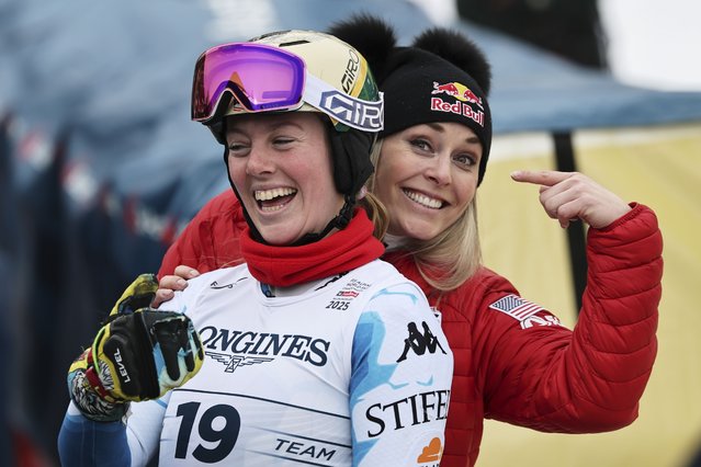 United States' A.J. Hurt and United States' Lindsey Vonn, right, smile at the finish area of a slalom run of a women's team combined event, at the Alpine Ski World Championships, in Saalbach-Hinterglemm, Austria, Tuesday, February 11, 2025. (Photo by Marco Trovati/AP Photo)