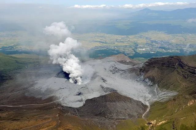 An aerial view shows volcanic ash around the eruptive crater of Mount Aso in Aso, Kumamoto prefecture, southwestern Japan, in this photo taken by Kyodo September 14, 2015. Mount Aso, a volcano on Japan's main southern island of Kyushu, erupted on Monday, Japan's Meteorological Agency said, blasting a plume of black smoke 2 km (1.2 miles) high, but there were no immediate reports of damage or injuries. (Photo by Reuters/Kyodo News)