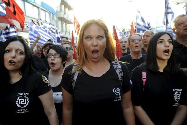 Far-right Golden Dawn party supporter shouts slogans a pre-election rally outside the party's headquarters in Athens, Greece, September 16, 2015. (Photo by Michalis Karagiannis/Reuters)