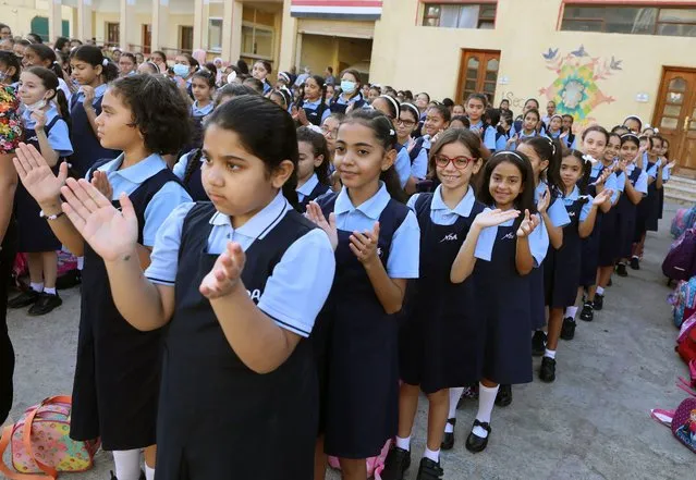 Pupils attend the first day at school, as the new academic year starts at Notre Dame school in Cairo, Egypt, 01 October 2022. Egypt's Ministry of Education announced that the new academic school year start on 01 October. (Photo by Khaled Elfiqi/EPA/EFE)