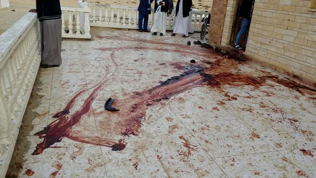 A blood trail on the veranda of Al-Rawda Mosque in Bir al-Abd northern Sinai, Egypt a day after attackers killed hundreds of worshippers, on Saturday, November 25, 2017. Friday's assault was Egypt's deadliest attack by Islamic extremists in the country's modern history, a grim milestone in a long-running fight against an insurgency led by a local affiliate of the Islamic State group. (Photo by Tarek Samy/AP Photo)