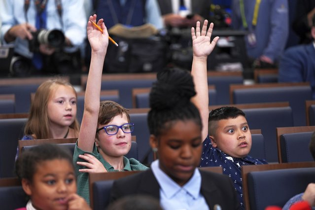 Children raise their hands as White House press secretary Karoline Leavitt speaks during a briefing for “Take Our Sons and Daughters To Work Day” at the White House, Tuesday, May 20, 2025, in Washington. (Photo by Evan Vucci/AP Photo)
