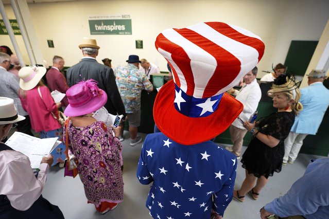 Tre Moser wears patriotic clothing at Churchill Downs before the 151st running of the Kentucky Oaks horse race Friday, May 2, 2025, in Louisville, Ky. (Photo by Charlie Riedel/AP Photo)