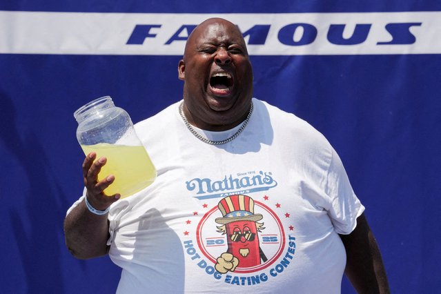 Badlands Booker shouts while attempting to break his own record in lemonade drinking, during the 2025 Nathan's Famous International Hot Dog Eating Contest, at Coney Island, Brooklyn in New York City on July 4, 2025. (Photo by David 'Dee' Delgado/Reuters)