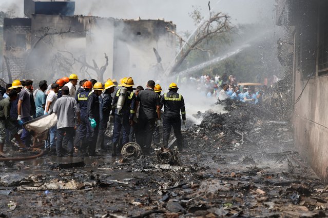 Firefighters work to put out a fire at the site where an Air India Boeing 787 Dreamliner plane crashed in Ahmedabad, India, on June 12, 2025. (Photo by Amit Dave/Reuters)