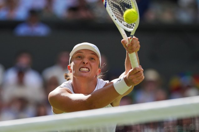Poland's Iga Swiatek returns to Amanda Anisimova of the U.S. during the women's singles final at the Wimbledon Tennis Championships in London, Saturday, July 12, 2025. (Photo by Kin Cheung/AP Photo)
