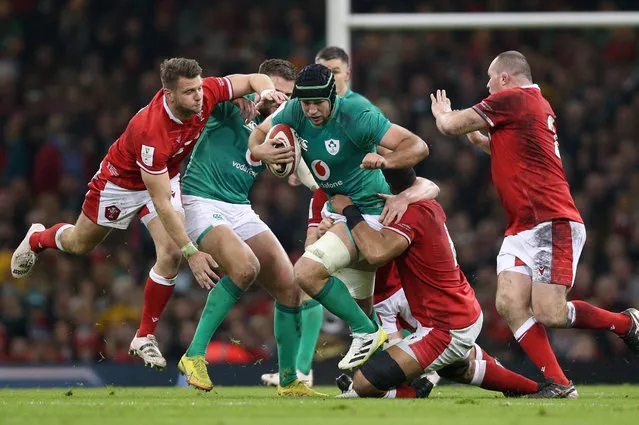 Ireland's Caelan Doris is tackled by Wales' Taulupe Faletau during the Guinness Six Nations match at the Principality Stadium, Cardiff on Saturday, February 4, 2023. (Photo by Nigel French/PA Images via Getty Images)