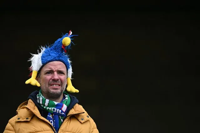 A France supporter sporting comical headwear awaits kick-off in the Six Nations international rugby union match between Ireland and France at the Aviva Stadium in Dublin on February 11, 2023. (Photo by Paul Ellis/AFP Photo)
