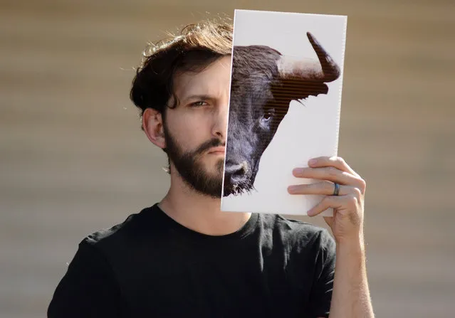 A man demonstrates against bullfighting during a protest called by the NGO AnimaNaturalis as part of their campaign against animal abuse, outside the Merida bullring, in the Mexican state of Yucatan, on March 18, 2018. Mexico is one of only eight countries in the world where bullfights are still held, along with Spain, Portugal, France, Ecuador, Colombia, Peru and Venezuela. (Photo by Luis Perez/AFP Photo)