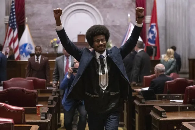 Former Rep. Justin Pearson, D-Memphis, raises his fists as he leaves the House chamber after he is expelled from the legislature Thursday, April 6, 2023, in Nashville, Tenn. Tennessee Republicans ousted two of three House Democrats for using a bullhorn to shout support for pro-gun control protesters in the House chamber. (Photo by George Walker IV/AP Photo)