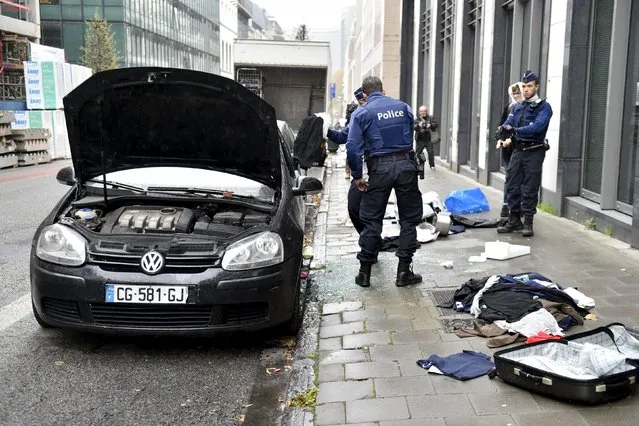 Police officers check a suspected car during an alert in Brussels, Belgium, November 16, 2015, following the deadly attacks in Paris. (Photo by Eric Vidal/Reuters)