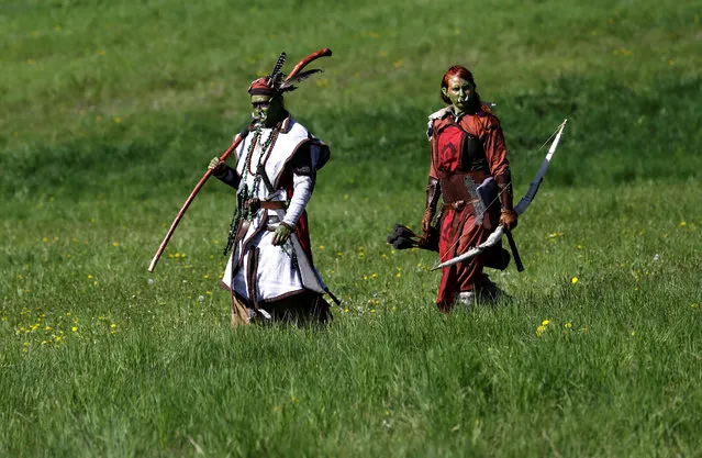 People dressed as characters from the computer game “World of Warcraft” walk across a field near the town of Kamyk nad Vltavou, Czech Republic, April 28, 2018. (Photo by David W. Cerny/Reuters)
