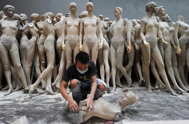 An employee works on a mannequin at a Top Mannequin factory in Kuala Lumpur July 10, 2010. (Photo by Samsul Said/Reuters)