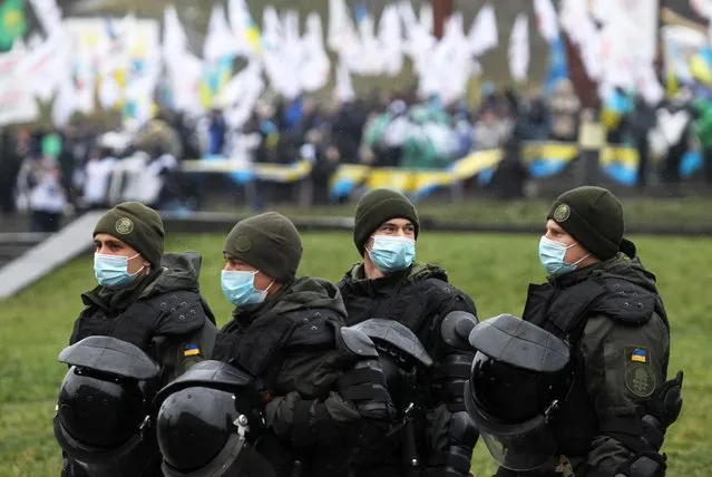 Servicemen of National guard stand during a rally of representatives of small businesses the “Save FOP” (“Save individual-entrepreneurs”) amid the ongoing coronavirus (COVID-19) pandemic on Independence Square in Kiev, Ukraine, on December 18, 2020. Small businesspeople from all country gathered in Ukrainian capital to demand the abrogation of the amendments to a law about the simplified tax system, and against restrictive measures amid the ongoing coronavirus (COVID-19) pandemic. (Photo by Vladimir Shtanko/Anadolu Agency via Getty Images)