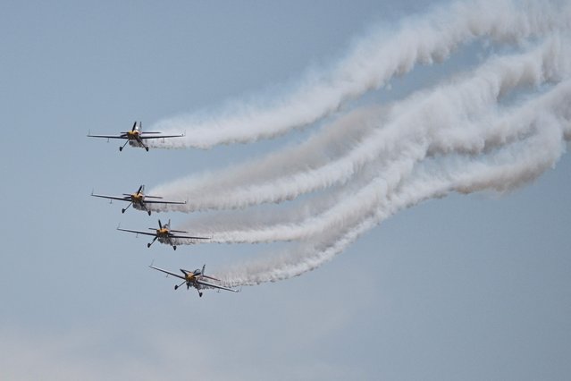The Marksmen aerobatic team from South Africa performs during the Aero Asia 2025 in Zhuhai, in southern China's Guangdong province on November 27, 2025. Aero Asia 2025 is an international aviation and aerospace exhibition that runs between November 27 and 30. (Photo by Hector Retamal/AFP Photo)