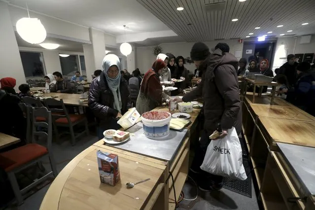 Refugees are seen in a dining room in their camp at a hotel touted as the world's most northerly ski resort in Riksgransen, Sweden, December 15, 2015. (Photo by Ints Kalnins/Reuters)