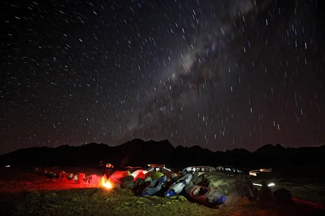 August 17, 2012 – Alpamarca, Peru – The Milky Way and stars swirl above the Amazon Express expedition on this time exposure at base camp on Lago Acucocha. Lago Acucocha may be the dry season source of the Amazon River. (Photo by Erich Schlegel/zReportage via ZUMA Press)