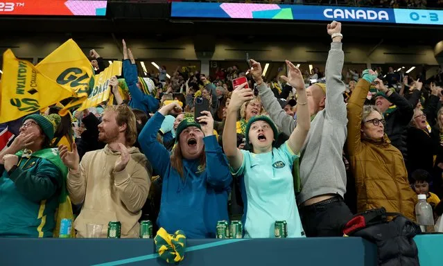 Australia fans celebrate the team's fourth goal during the FIFA Women's World Cup Australia & New Zealand 2023 Group B match between Canada and Australia at Melbourne Rectangular Stadium on July 31, 2023 in Melbourne / Naarm, Australia. (Photo by Alex Grimm – FIFA/FIFA via Getty Images)