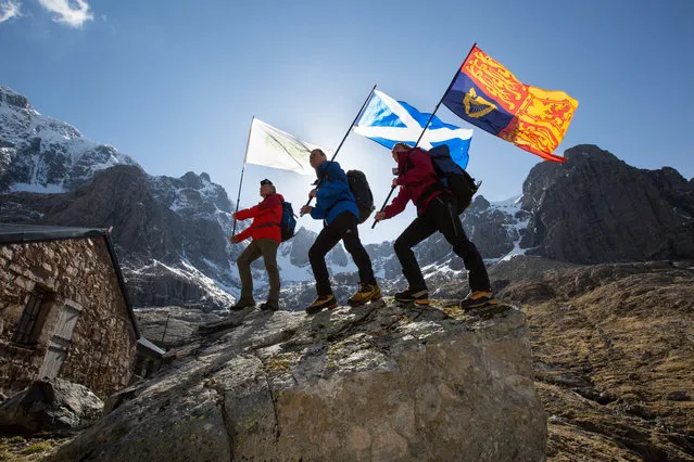 (L-R) Uisdean MacDonald, Max and Lena Hunter, all senior instructors at Outward Bound at Loch Eil underneath the North east face of Ben Nevis with the flags on April 17, 2021 in Ben Nevis, Scotland. HRH The Duke of Edinburghs longest charitable commitment was with The Outward Bound Trust an organisation committed to the development of young people through powerful learning and adventure in the wild. Outward Bound was founded in 1941 by HRH Prince Philips teacher at Gordonstoun and mentor, Kurt Hahn. The Duke of Edinburgh became involved at the organisations inception as a supporter, before joining its Board as Patron in 1953 until his retirement in 2019. He was also an active Chairman of the Board of Trustees for many years. As such, in honour of the Dukes wonderful involvement and support of the charity – on Saturday Outward Bound instructors will be summiting the UKs highest peaks Ben Nevis, Snowdon and Scafell Pike, and raising Royal Sovereign, Outward Bound and country specific flags in these locations, in memory and in tribute to HRH. (Photo by Robert Perry/Getty Images for The Outward Bound Trust)