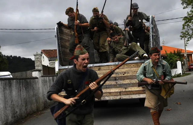 Actors take part in a re-enactment of the "Battle of Areces" that took place during the Spanish Civil War, in Grullos, north of Spain, September 14, 2013. The re-enactment of the historic 1937 battle was organised by the Frente del Nalon Association. (Photo by Eloy Alonso/Reuters)