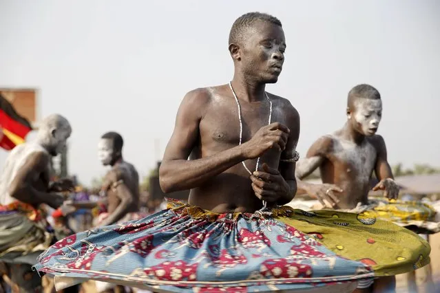 A devotee dances at the annual voodoo festival in Ouidah January 10, 2016. The national voodoo holiday in the West African country of Benin had a distinctively political accent this year as practitioners from Africa and the Americas gathered on Sunday to offer prayers and sacrifices for peace. (Photo by Akintunde Akinleye/Reuters)