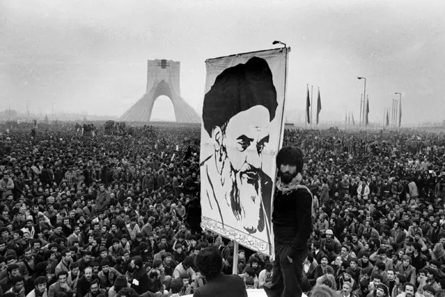 In this December 10, 1978 file photo of exiled Muslim leader Ayatollah Khomeini overshadows huge anti-Shah demonstration at the Shahyad monument commemorating 25 years of the monarch's rule and symbol of his power, in Tehran, Iran. The discovery in Iran of a mummified body near the site of a former royal mausoleum has raised speculation it could be the remains of the late Reza Shah Pahlavi, founder of the Pahlavi dynasty. (Photo by Michel Lipchitz/AP Photo)