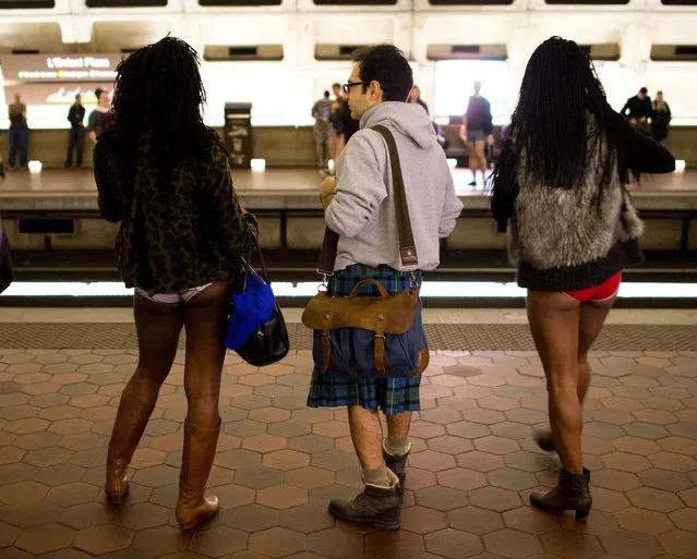 Participants in the No Pants Subway Ride DC, wait to ride the Metro on January 10, 2016 in Washington, DC. The No Pants Subway Ride is an annual event which was started in 2002 by Improv Everywhere in New York. (Photo by Andrew Caballero-Reynolds/AFP Photo)