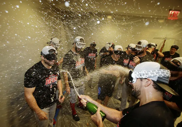 The Boston Red Sox celebrate after clinching the AL East title with an 11-6 win over the New York Yankees in a baseball game Thursday, September 20, 2018, in New York. (Photo by Frank Franklin II/AP Photo)