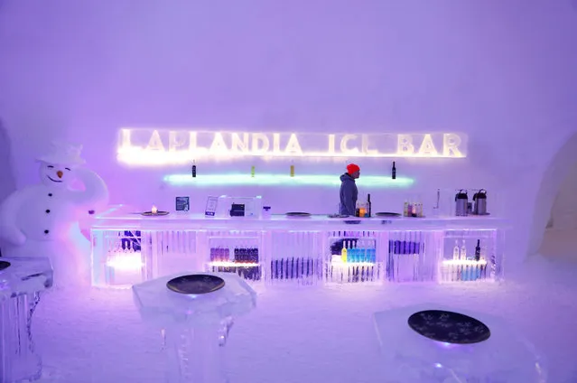 A barman waits for customers at the Arctice ice bar in the Santa Claus Village in the Arctic Circle near Rovaniemi, Finland, December 15, 2016. (Photo by Pawel Kopczynski/Reuters)