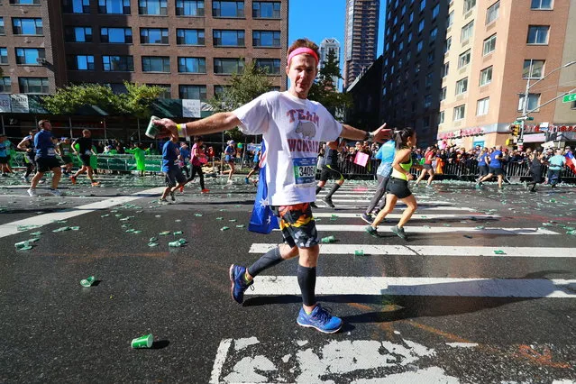 A participant shows off for the camera during the 2018 New York City Marathon, November 4, 2018. (Photo by Gordon Donovan/Yahoo News)