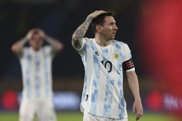 Argentina's Lionel Messi gestures during a qualifying soccer match for the FIFA World Cup Qatar 2022 against Colombia at the Metropolitano stadium in Barranquilla, Colombia, Tuesday, June 8, 2021. Miguel Borja scored an equalizer for Colombia in the last seconds of added time against Argentina in one of the best matches yet in South American qualifying. (Photo by Fernando Vergara/AP Photo)