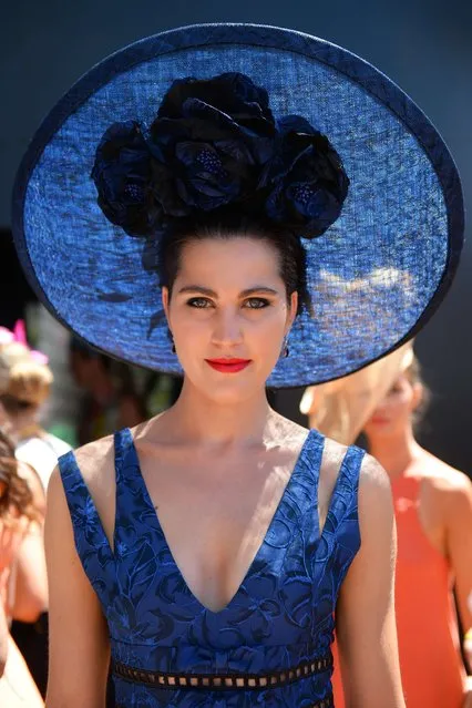 A race-goer models her outfit for the Fashion in the Field competition before the six million Australian dollar Melbourne Cup horse race in Melbourne on November 5, 2013. (Photo by William West/AFP Photo)