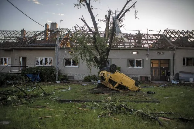 A view of damage after a tornado hit in Moravska Nova Ves, Czech Republic, 25 June 2021. A rare tornado on 24 June evening swept through the region of South Moravia, in south-eastern Czech Republic, leaving thousands of houses destroyed and damaged, authorities announced. At least three people died, according to a spokesperson of the regional ambulance service. (Photo by Martin Divisek/EPA/EFE)