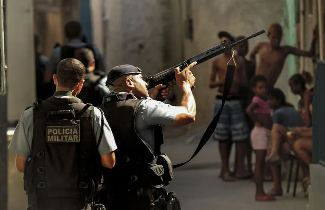 Military Police carry out an operation against drug trafficking in the favelas of the north zone of the city of Rio de Janeiro on October 6, 2022. The war against drug trafficking is part of a terrible daily life for the residents of the city's favelas. (Photo by Fabio Teixeira/Anadolu Agency via Getty Images)