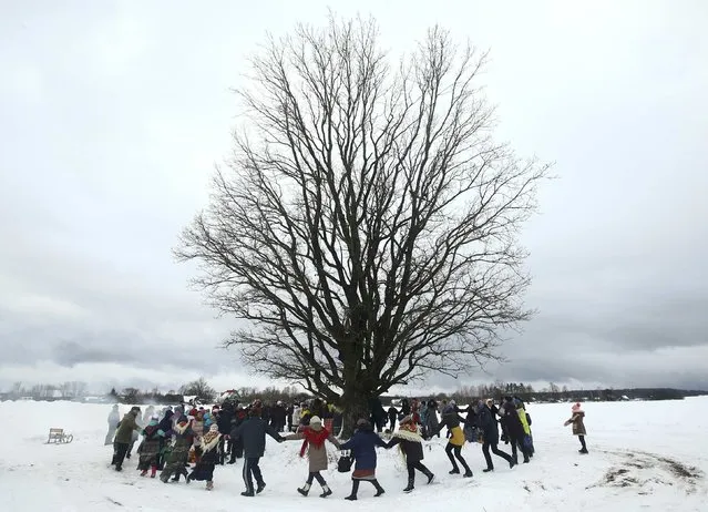 Local residents take part in the celebrations of Kolyada pagan holiday, which over the centuries has merged with Orthodox Christmas festivities and marks the upcoming end of winter, in the village of Martsiyanauka, Belarus, January 21, 2017. (Photo by Vasily Fedosenko/Reuters)