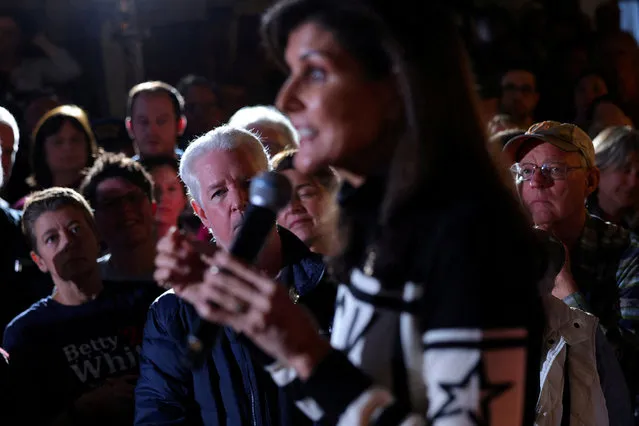 Audience members listen as Republican presidential candidate and former U.S. Ambassador to the United Nations Nikki Haley speaks during a campaign town hall at the Last Chair Brewery and Restaurant in Plymouth, New Hampshire on December 28, 2023. (Photo by Brian Snyder/Reuters)