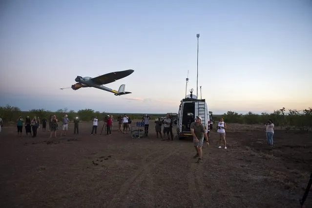Unmanned Aerial Vehicle (UAV) pilot Stephan Denecker launches a UAV with a bungee system on an airstrip at the Kruger National Park, South Africa, 06 March 2016. The UAV technology is part of the an anti-poaching iniative to be implemented in the Kruger National Park for 2017. The UAV's night time flying capabilities is expected to reduce response time in dealing with incidents in the Kruger National Park. (Photo by Shiraaz Mohamed/EPA)