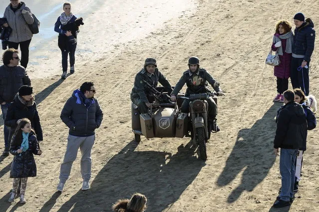 World War II enthusiasts take part in a re-enactment to mark the 70th anniversary of the Allied landings on Anzio beach, 52 km south of Rome, on January 25, 2014. (Photo by Andreas Solaro/AFP Photo)