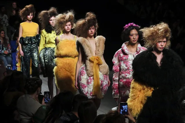 Models display creations by Portuguese designer David Ferreira on the second day of the Lisbon Fashion Week, at the Carlos Lopes Pavillion in Lisbon, Portugal, 09 March 2019. (Photo by Miguel A. Lopes/EPA/EFE)