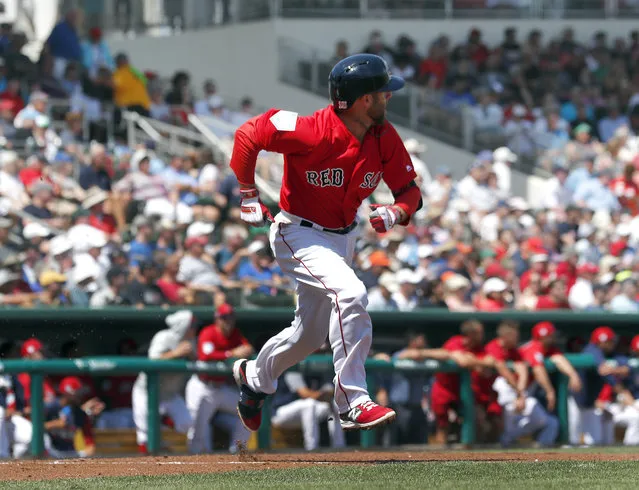 Boston Red Sox' Dustin Pedroia runs to first with a base hit in the first inning of a spring training baseball game against the Detroit Tigers Tuesday, March 12, 2019, in Fort Myers, Fla. (Photo by John Bazemore/AP Photo)
