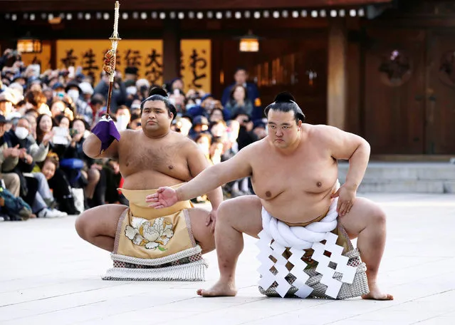 Newly promoted sumo grand champion, or yokozuna, Kisenosato (R), wearing a ceremonial belly band, performs a sacred ring-entering ritual at Meiji Shrine in Tokyo, Japan, in this photo taken by Kyodo Japan, January 27, 2017. (Photo by Reuters/Kyodo News)