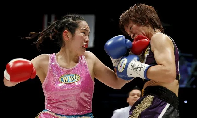 Japan's Kumiko Seeser Ikehara (L) punches her compatriot Kayoko Ebata during their WBO women's minimumweight boxing title bout in Tokyo May 6, 2015. (Photo by Toru Hanai/Reuters)