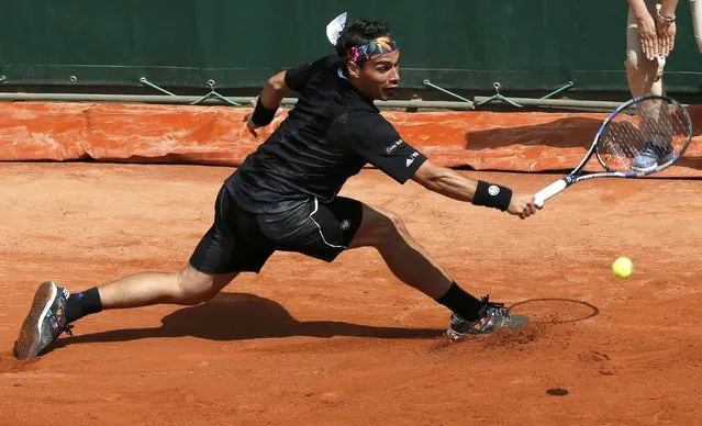 Fabio Fognini of Italy plays a shot to Japan's Tatsuma Ito during their men's singles match at the French Open tennis tournament at the Roland Garros stadium in Paris, France, May 25, 2015. (Photo by Gonzalo Fuentes/Reuters)